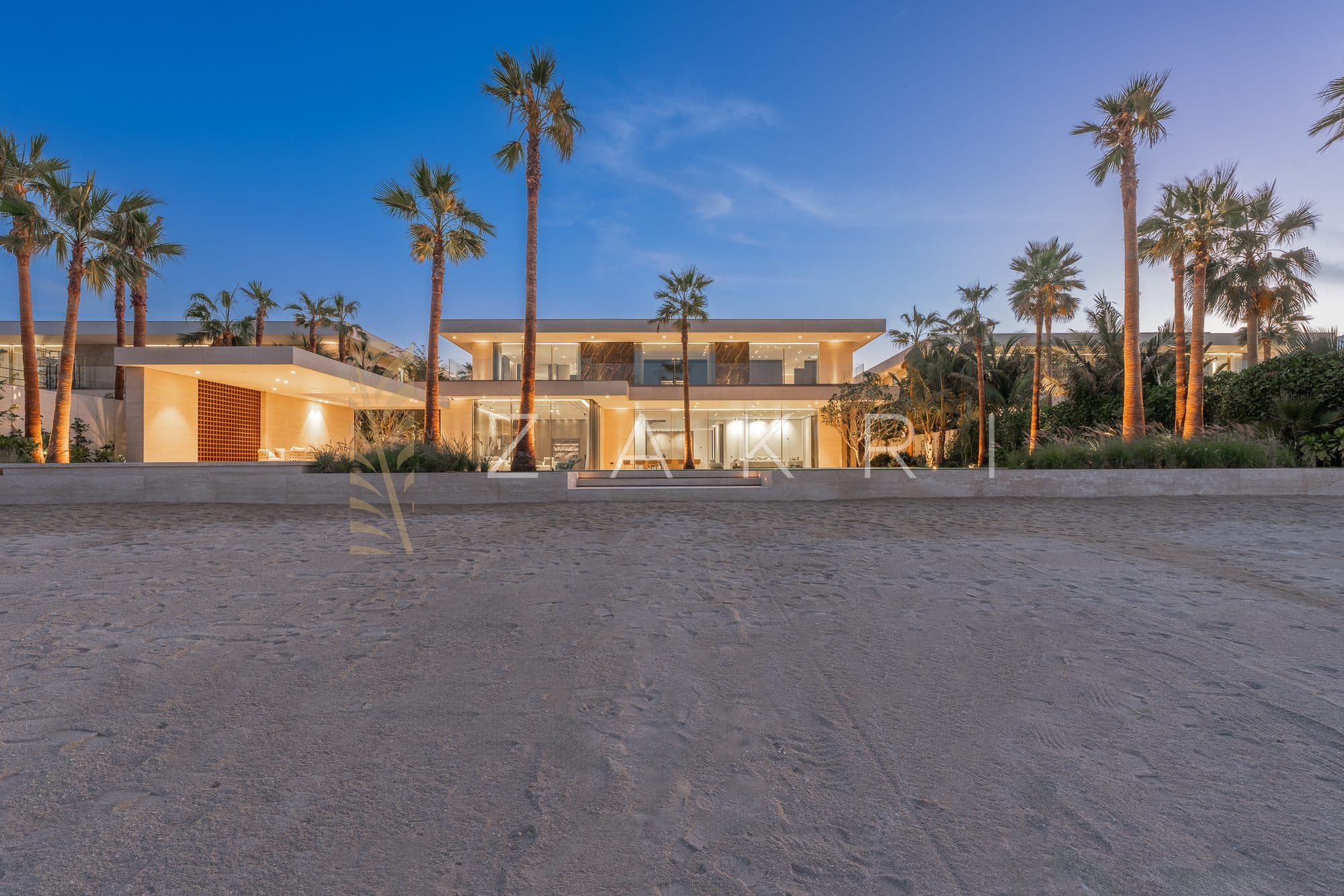The villa seen from the beach frontage in daylight