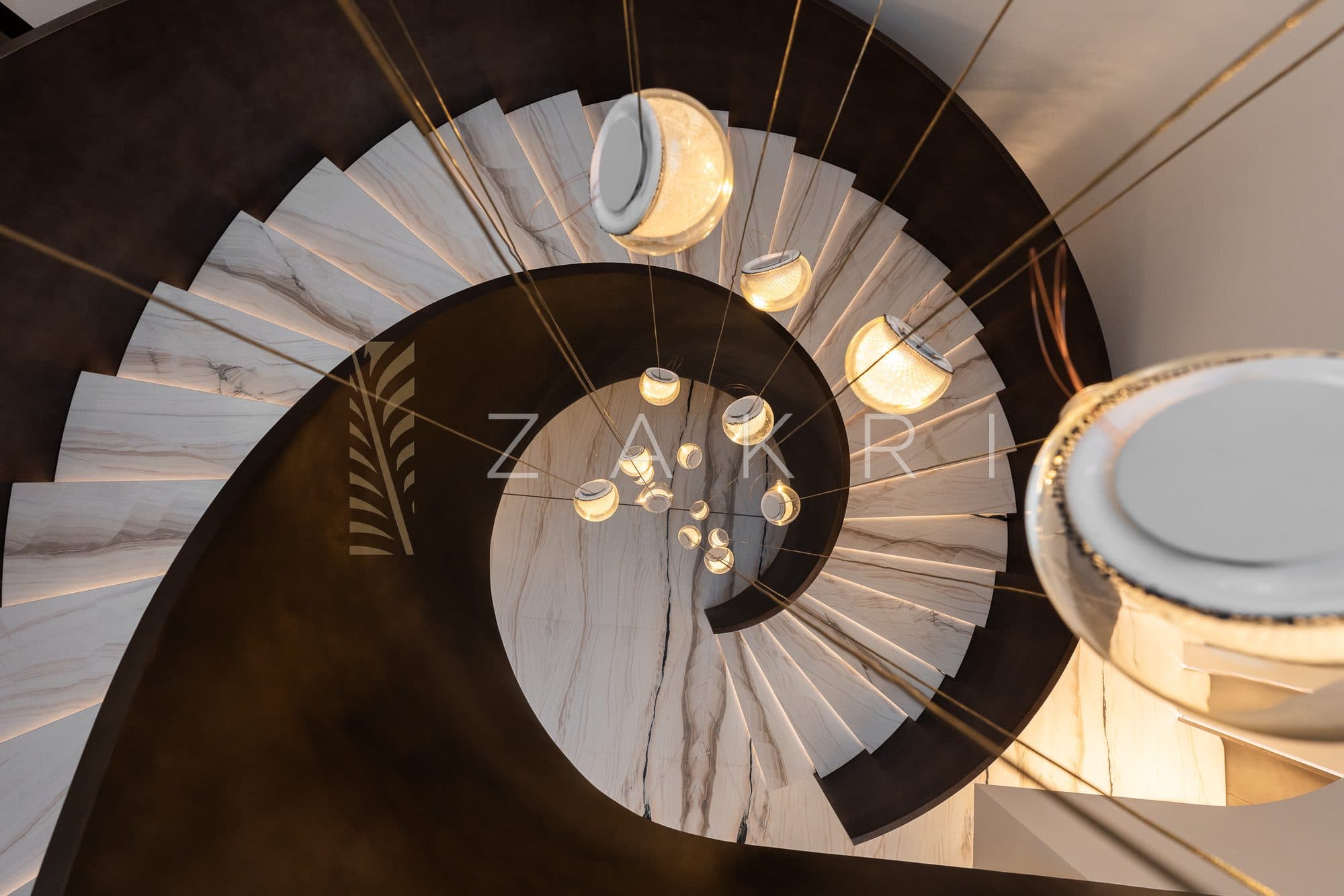 The staircase seen from above, spiralling through the house