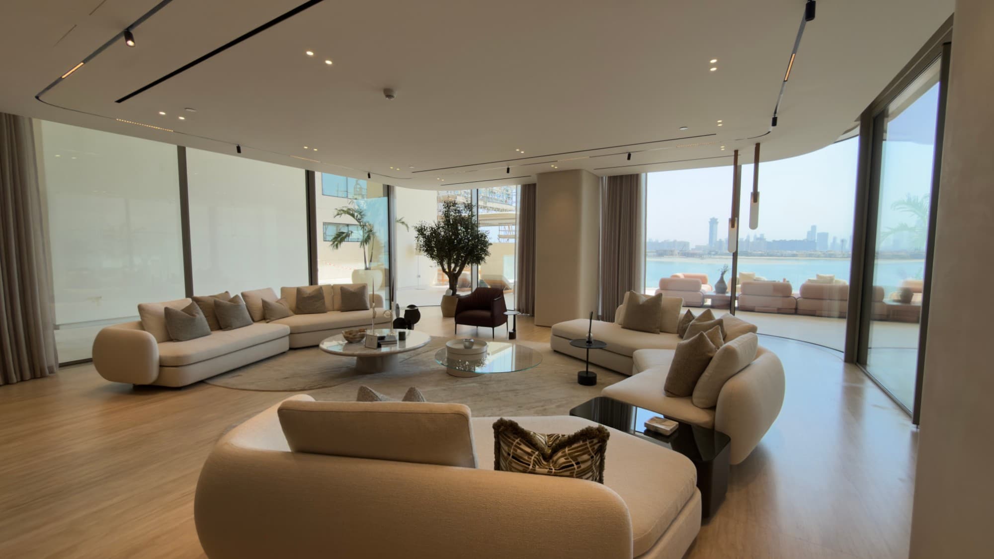 The formal living area, glazed the full height to the terrace and the sea
