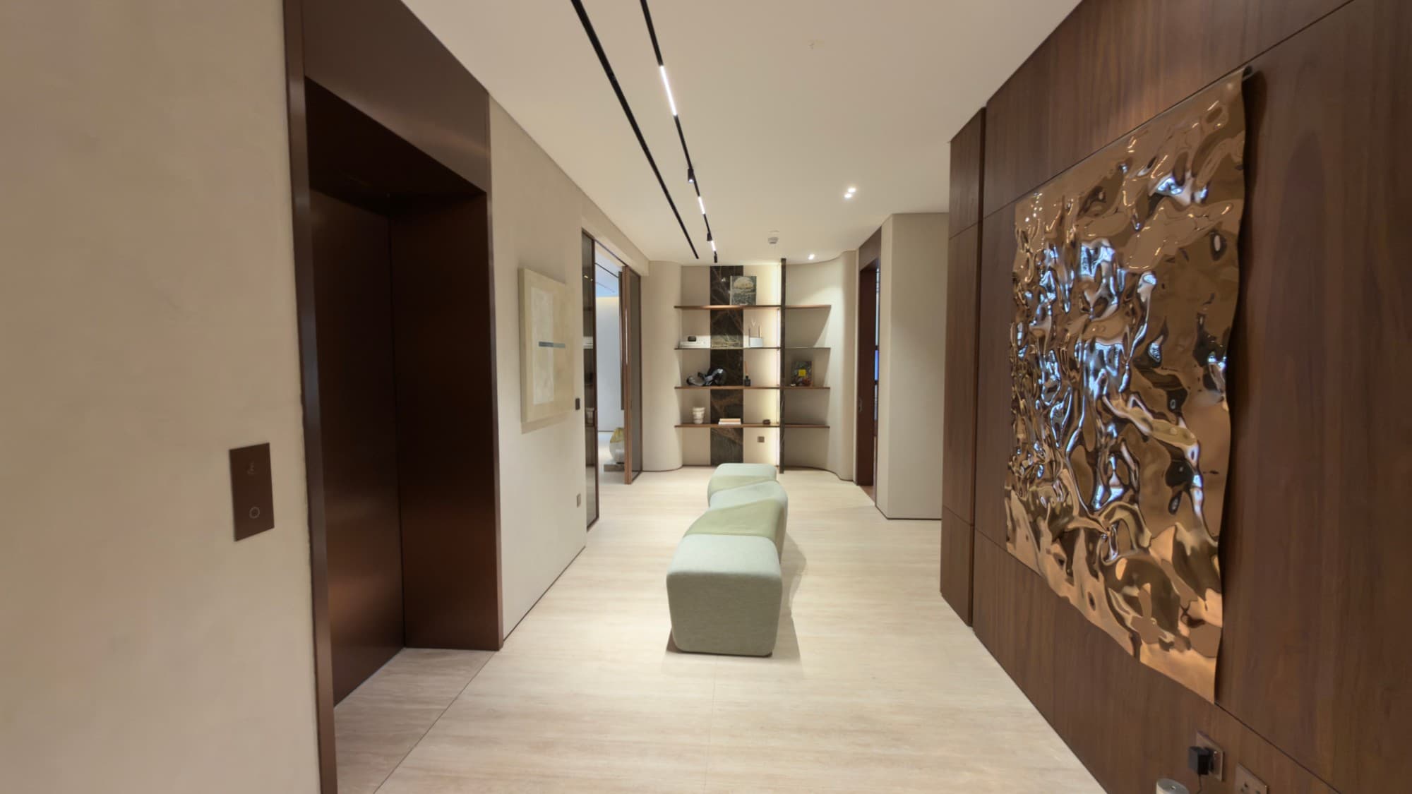 The private lift lobby, with a cast bronze wall piece