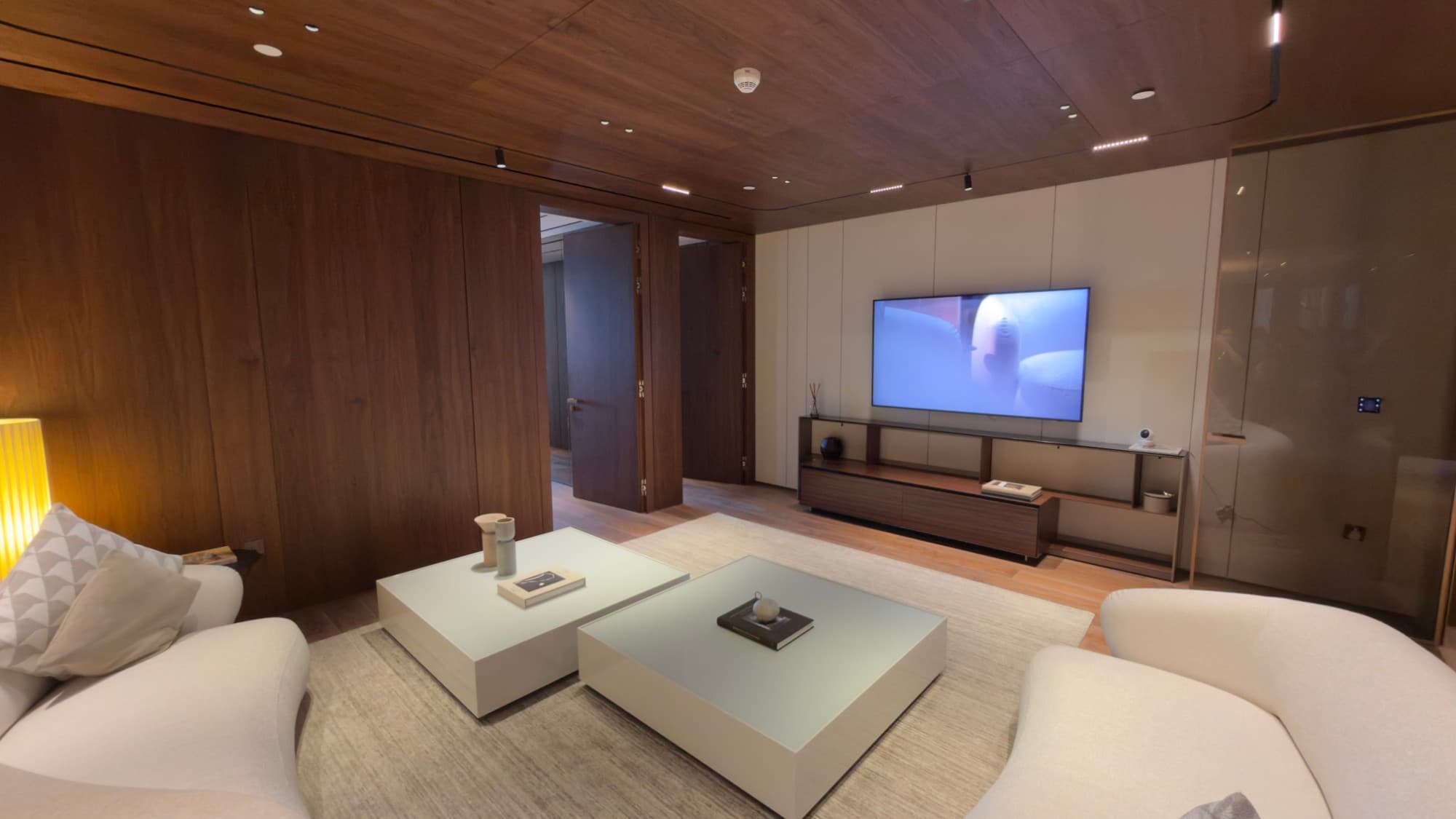The media lounge, panelled and ceiled in American walnut
