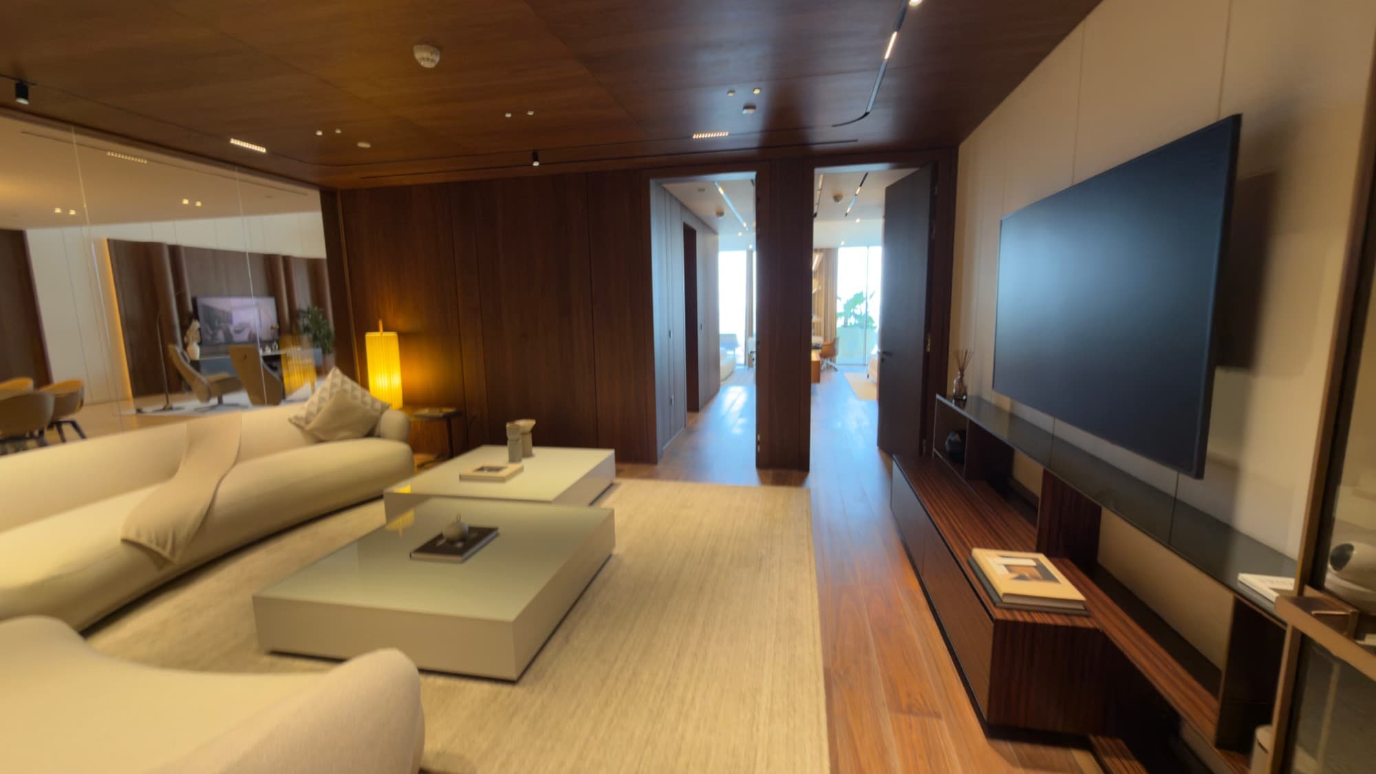 The media lounge, with the rest of the residence beyond its doors
